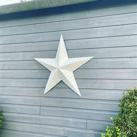 what do the metal stars on people's houses mean|outdoor barn star on house.